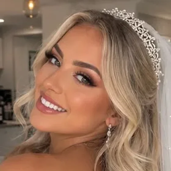Blonde bride in a tiara and veil with warm glam makeup, by Sadaf Bridal